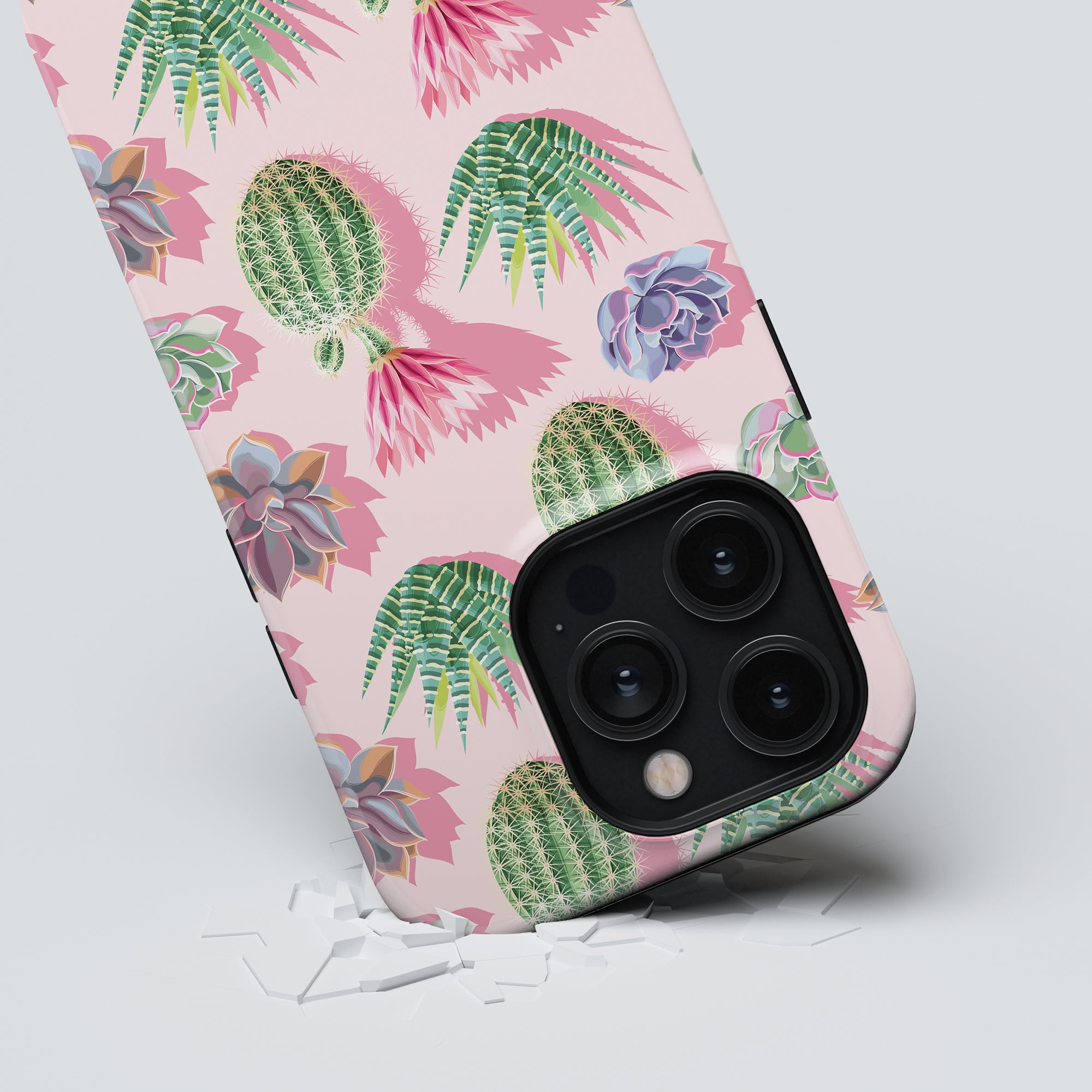 Smartphone with a Cactus Pop - Tough case in pink, showcasing an angled view of its colorful cactus and succulent design against a light background. Part of the Exotic Fruits Collection, this extremt stöttålig case merges style and durability effortlessly.