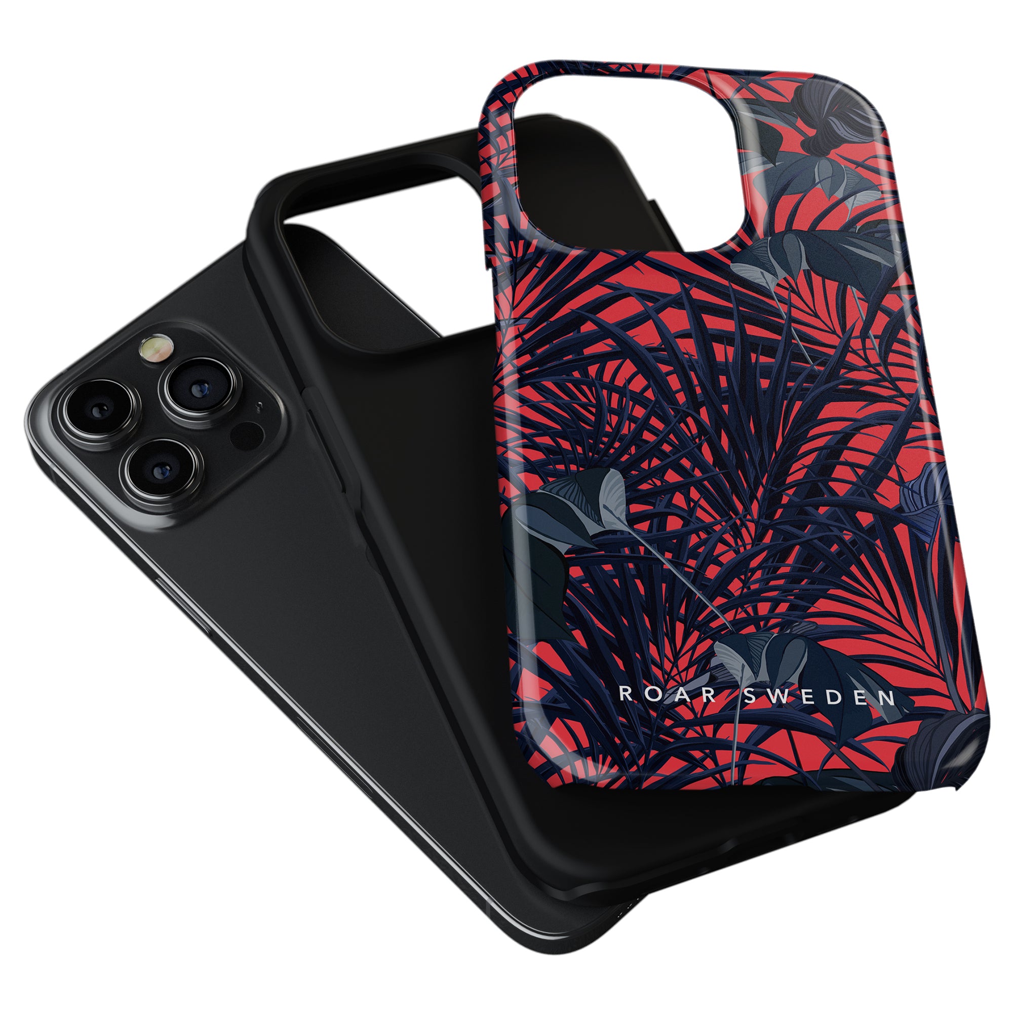 Two smartphone cases, one plain black and one from the Jungle Collection with a red and blue floral pattern labeled "Red Tropics - Tough Case," lie on top of a smartphone.