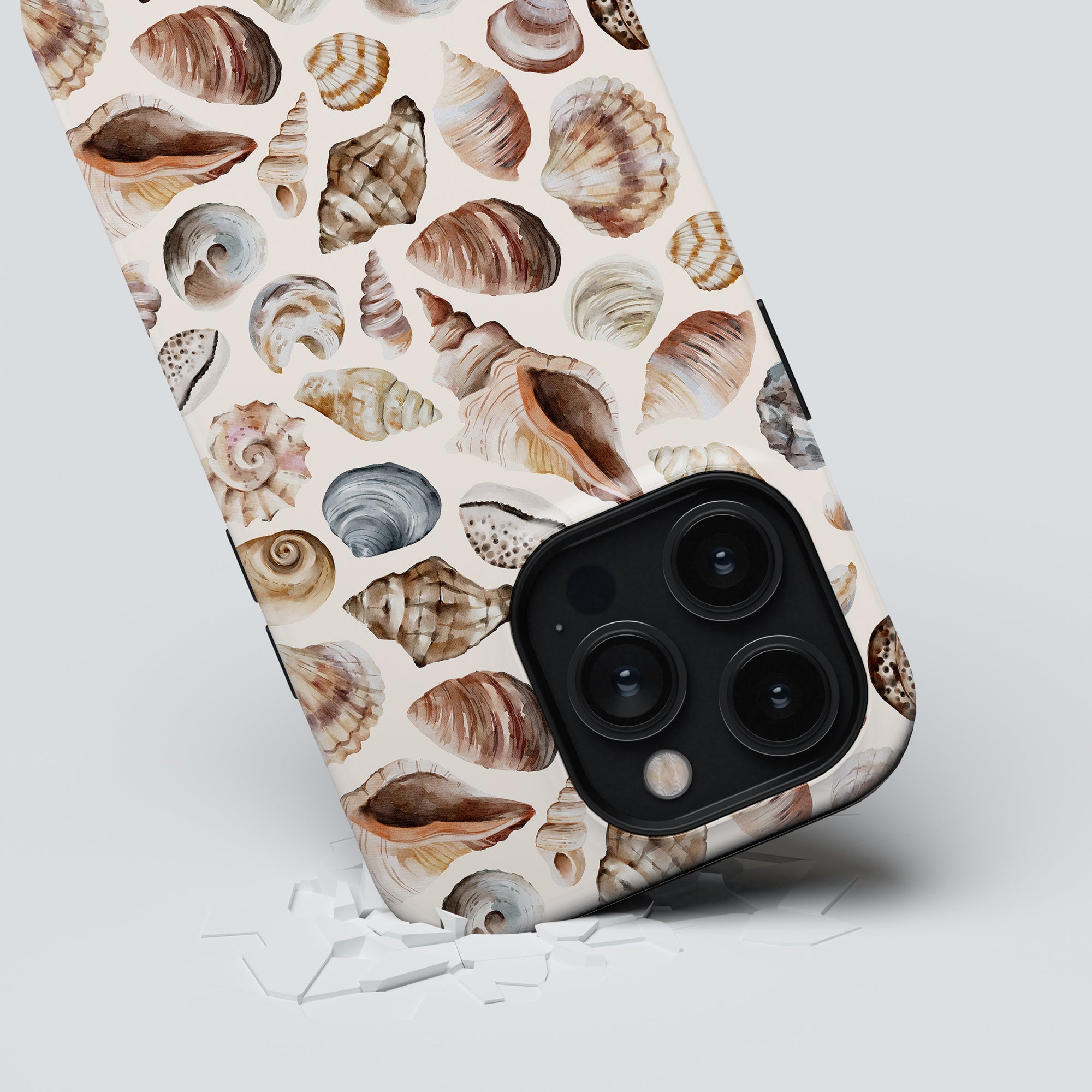 Smartphone with Beach Shells - Tough Case lying on a white surface.