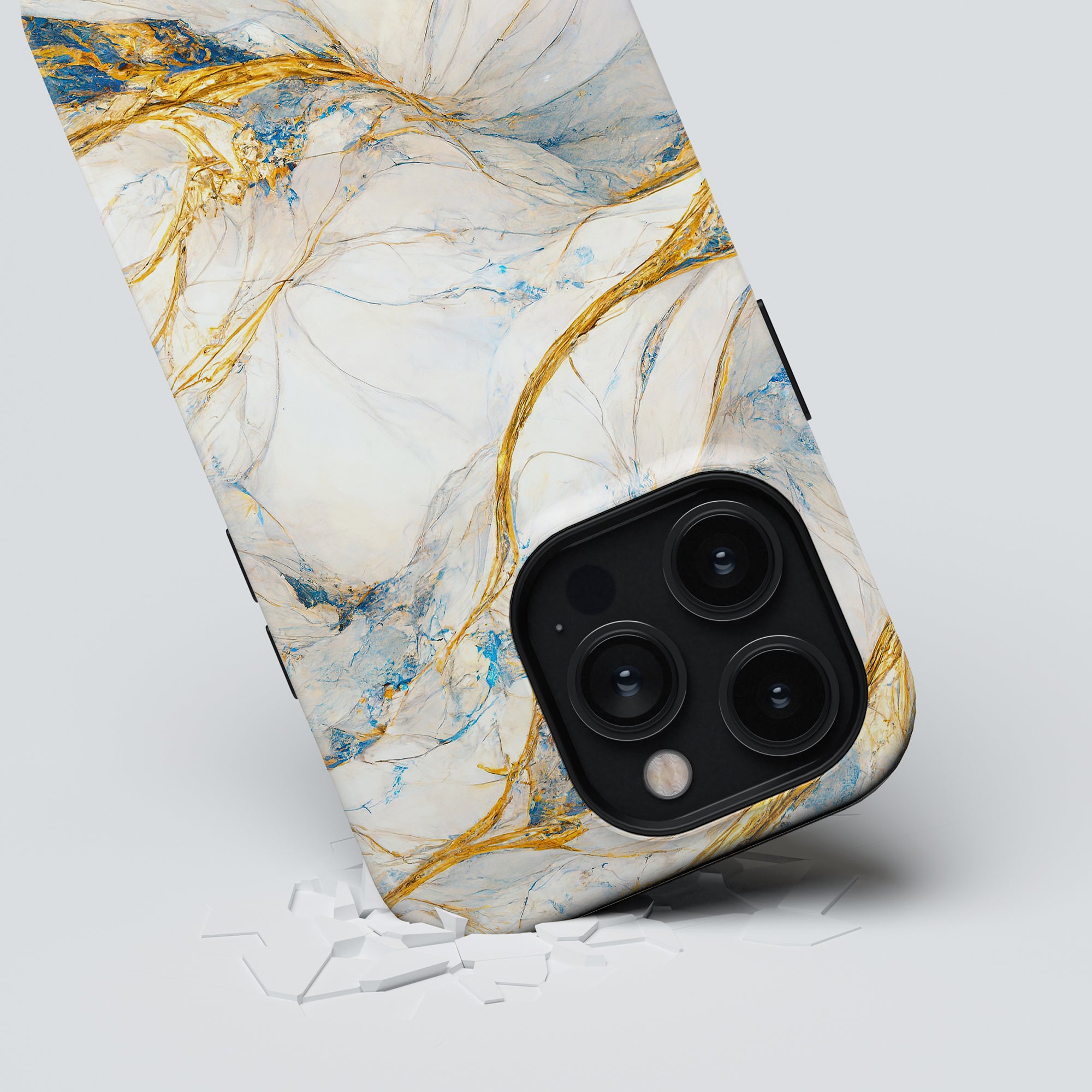 A smartphone with a Queen Marble - Tough Case, three camera lenses, partially submerged in a white cracked surface.
