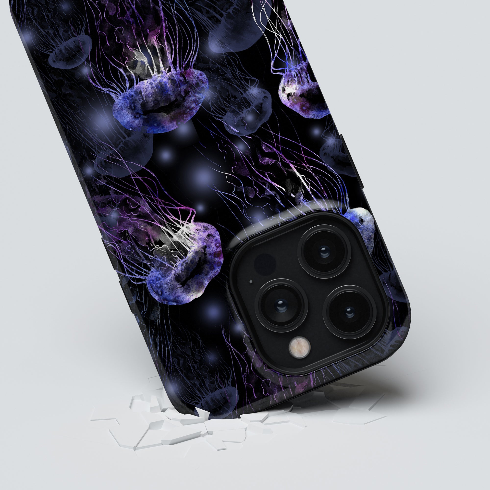 Smartphone with a Smack - Tough Case breaking through a glass surface, showcasing its rear cameras.