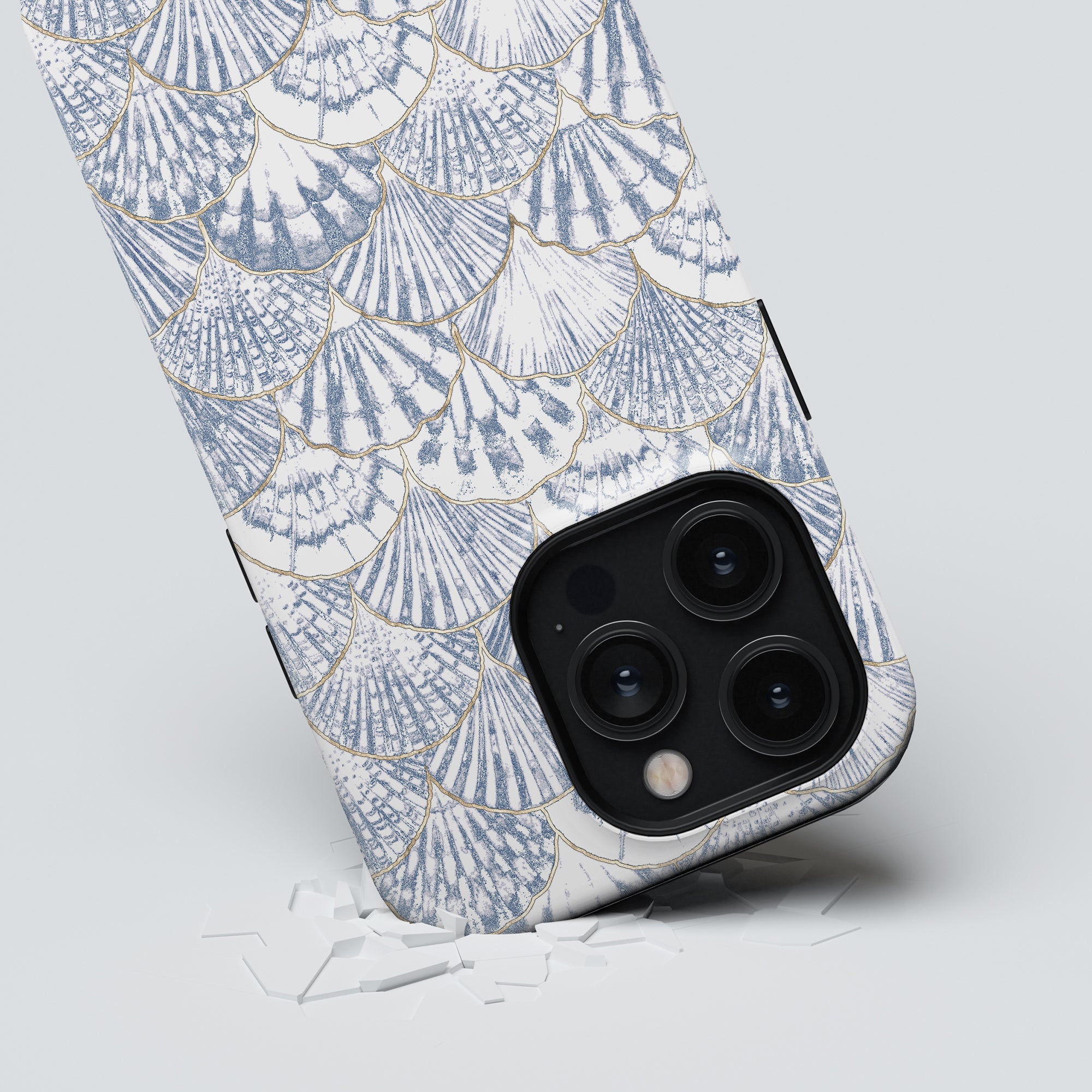 A smartphone with a Valencia - Tough Case from the Ocean Collection featuring a triple-lens camera breaking through glass.